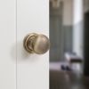 Old English Harrogate Door Knob Pack (Lock Set - Horizontal Bathlock, 4" Slim Knuckle Hinges x2) - Matt Antique Brass