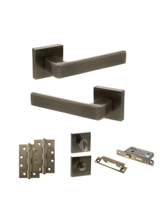 STATUS Montana Door Handle Pack (Bathroom Set - 3" CE Bathroom Lock, 4" Slim Knuckle Hinges x2) - Antique Brass