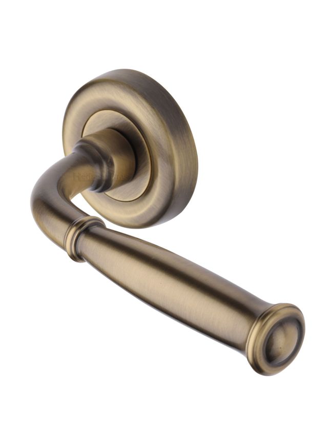 Heritage Brass Door Handle Lever Latch on Round Rose Lincoln Design Antique Brass finish
UK Registered Design Number 6228268
