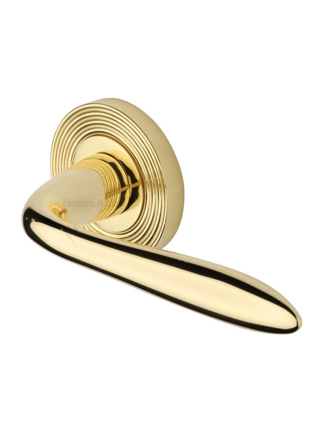 Heritage Brass Door Handle Lever Latch on Round Rose Sutton Reeded Design Polished Brass finish
UK Registered Design Number 6204750