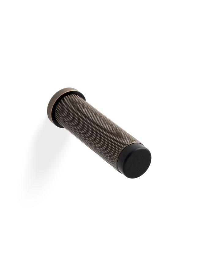 Valli 76 x 20mm - Wall Mounted Knurled Doorstop on Rose - Concealed Fix - Antique Brass