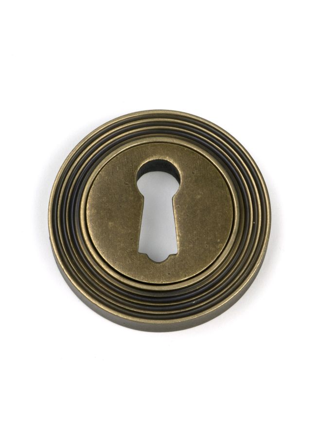 Burnished Brass Round Escutcheon (Beehive)