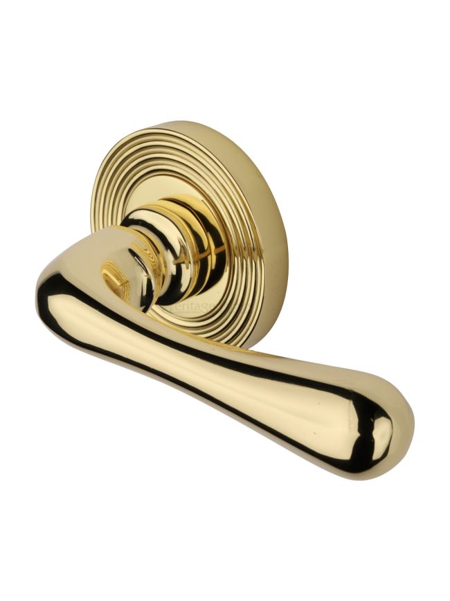 Heritage Brass Door Handle Lever Latch on Round Rose Charlbury Reeded Design Polished Brass finish
UK Registered Design Number 6226298