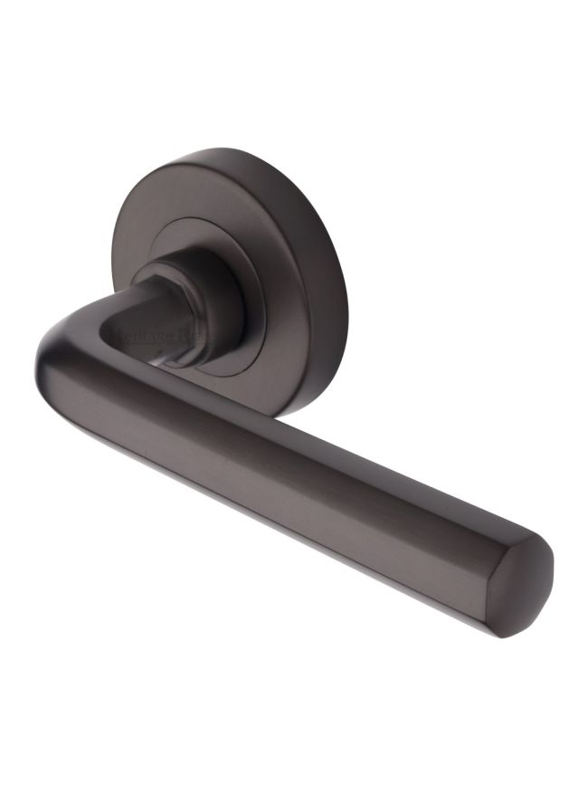 Heritage Brass Door Handle Lever Latch on Round Rose Octave Design Matt Bronze finish
UK Registered Design Number 6228267
