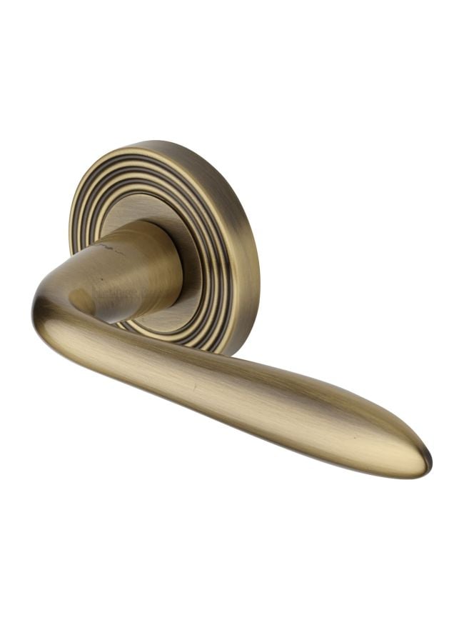 Heritage Brass Door Handle Lever Latch on Round Rose Sutton Reeded Design Antique Brass finish
UK Registered Design Number 6204750