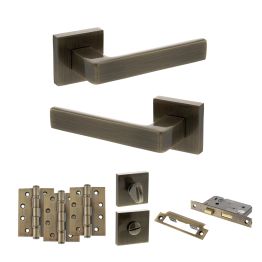 STATUS Montana Door Handle Pack (Bathroom Set - 2.5" CE Bathroom Lock, 4" Fire Rated Hinges x3) - Antique Brass