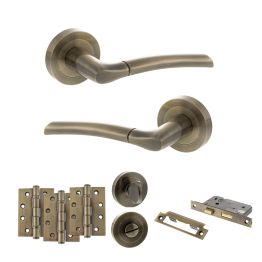 STATUS Indiana Door Handle Pack (Bathroom Set - 2.5" CE Bathroom Lock, 4" Fire Rated Hinges x3) - Antique Brass