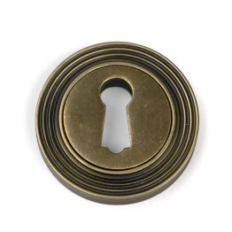 Burnished Brass Round Escutcheon (Beehive)