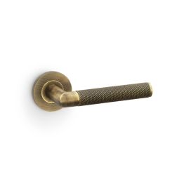 Alexander & Wilks - Harrier Knurled Lever on Round Rose - Antique Brass