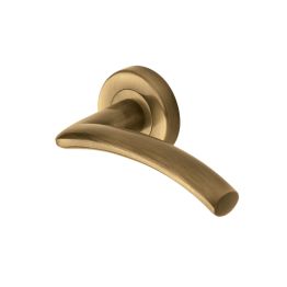 Heritage Brass Door Handle Lever Latch on Round Rose Centaur Design Antique Brass finish