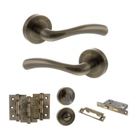 STATUS Texas Door Handle Pack (Bathroom Set - 3" CE Bathroom Lock, 3" Fire Rated Hinges x3) - Antique Brass