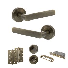 STATUS Carolina Door Handle Pack (Bathroom Set - 3" CE Bathroom Lock, 4" Slim Knuckle Hinges x2) - Antique Brass