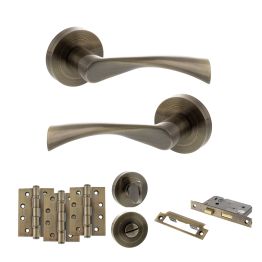 STATUS Colorado Door Handle Pack (Bathroom Set - 2.5" CE Bathroom Lock, 4" Fire Rated Hinges x3) - Antique Brass