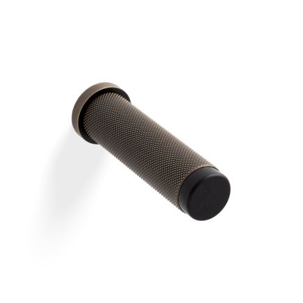 Valli 76 x 20mm - Wall Mounted Knurled Doorstop on Rose - Concealed Fix - Antique Brass