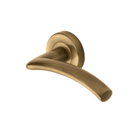 Heritage Brass Door Handle Lever Latch on Round Rose Centaur Design Antique Brass finish